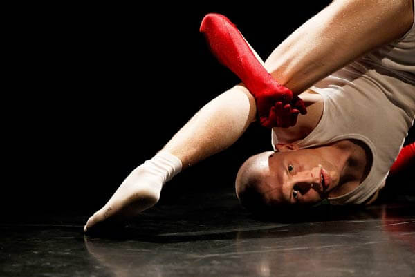 A student performing on black Harlequin Standfast stage floor at Palucca University of Dance
