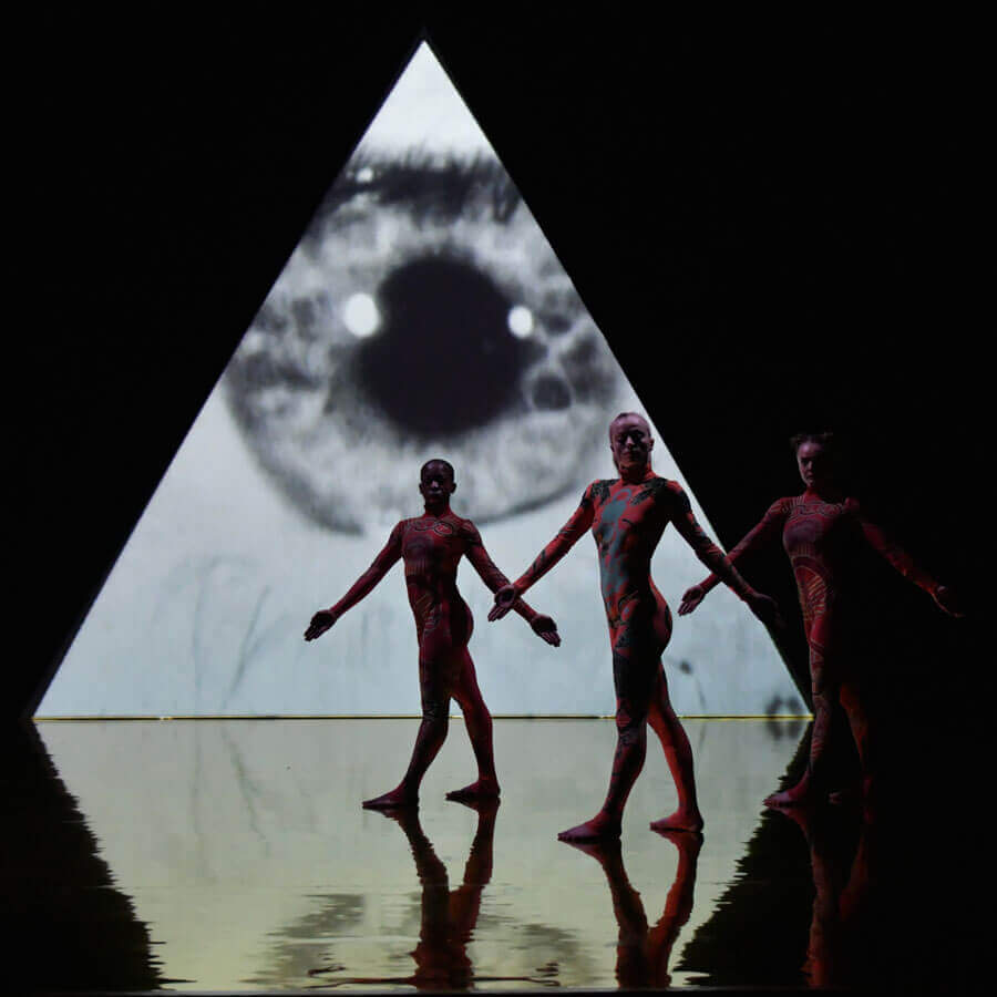 Dancers in front of projection which is reflected on the Harlequin Hi-Shine high gloss floor