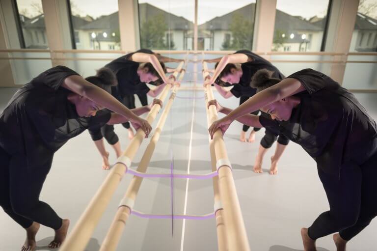 Dance mirrors creating the illusion of double the students in the rehearsal studio