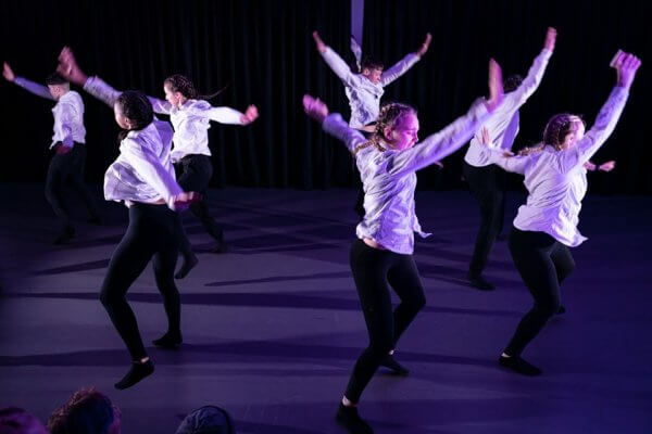 Students performing on stage