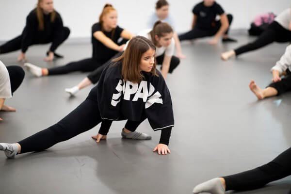 Students during a rehearsal inside a studio
