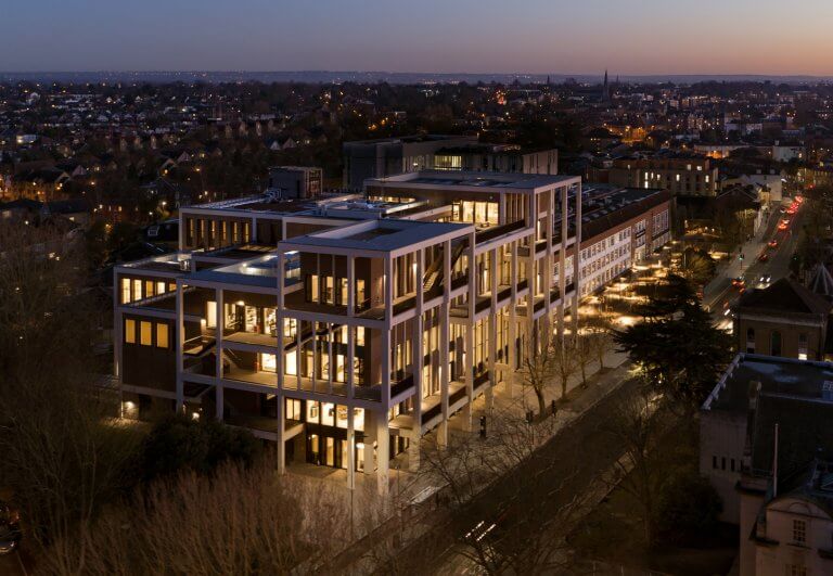 The Town House building illuminated by night