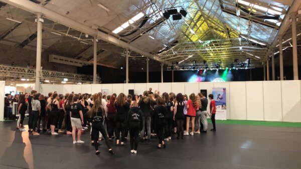 Layton Williams teaching a class on a Harlequin floor