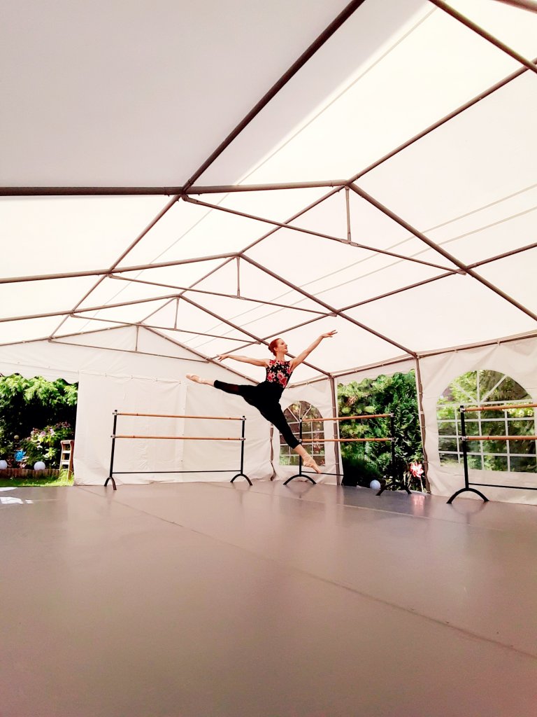 Franziska Rengger performing a jump on her Harlequin floor