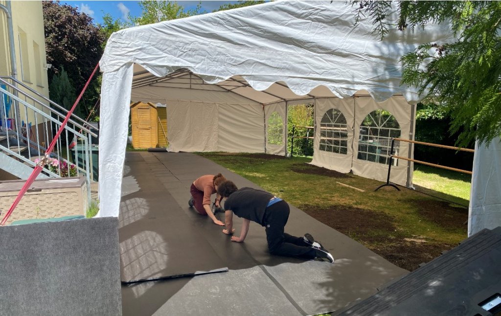 Franziska Rengger and Mikhail Kaniskin installing the Harlequin sprung floor panels