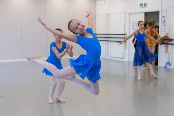 Jumping, grinning little ballerina at Ballettskolen Holstebro